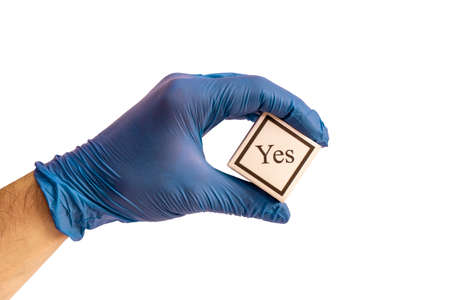 Hand in a medical glove with a symbol. Concept for design. Medicine. Diagnosis. Isolated white background. Copy space.の写真素材