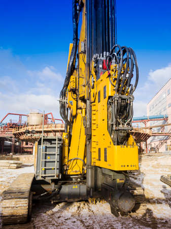 Powerful hydraulic drilling rig. Drilling and piling. Foundations in construction. Geology. Vibratory immersion.の写真素材