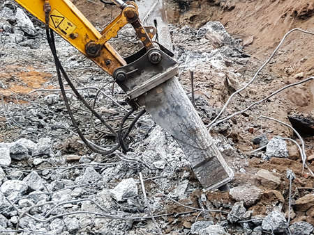 Construction work - dismantling. Professional demolition of reinforced concrete structures using...