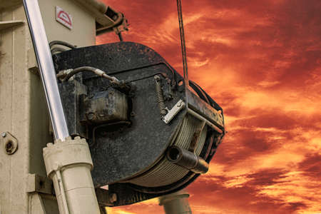 Rig elements on the background of the sunset sky. Exploration of useful minerals. Industry and...