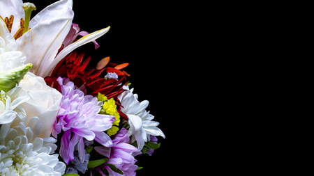 A bouquet of flowers from gerberas, chrysanthemums, lilies. Close-up. Macro shooting. Black background.の写真素材