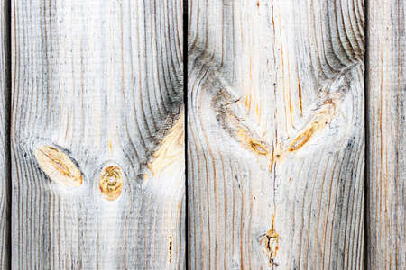 Old wooden planks with peeling paint. Background for design. Old board. The effect of weather on wood.の写真素材