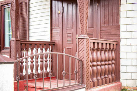 Old wooden porch. Entrance to the house. Old wooden structures. Architecture and construction....