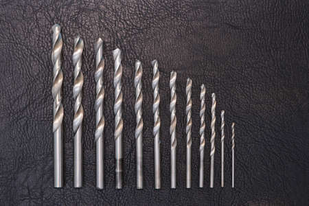 Metal drill set for drilling holes. Construction and home repair. Household chores. Copy space for...