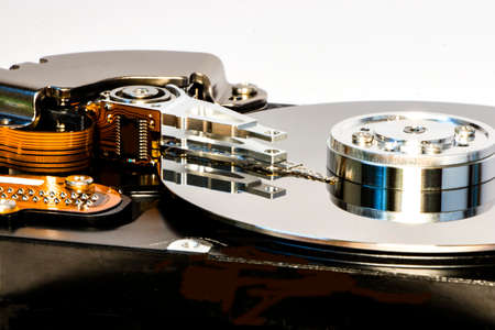Disassembled hard drive from the computer, hdd with mirror effect. Opened hard drive from the...
