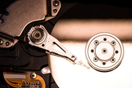 Disassembled hard drive from the computer, hdd with mirror effect. Opened hard drive from the...