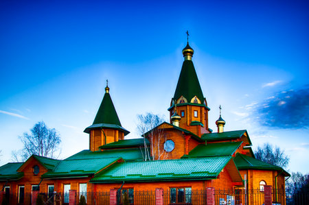 Orthodox wooden church at dawn. Temple of the Blessed Matrona of Moscow Soligorsk