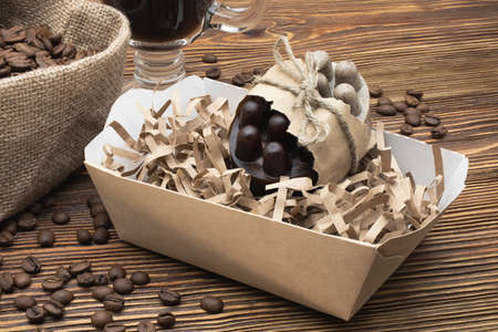 Handmade soap with natural coffee on a wooden surface. Natural organic home cosmetics for skin care....