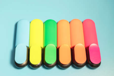 Bright colored markers for highlighting text on a blue background, colored felt-tip pens for drawing