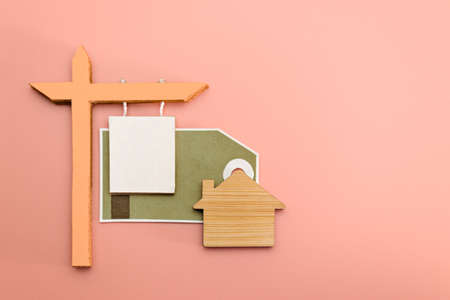 The concept of mortgage, sale and rental of housing and real estate. Mortgage credit lending. Announcement for the sale or lease of a house with sticker. Copy space. Mock-upの写真素材