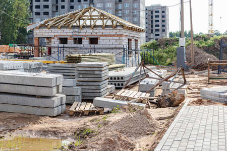 Storage of materials at the construction site. Reinforced concrete slabs for construction. Erection...