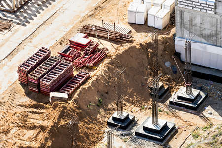 Monolithic reinforced concrete foundations for the construction of a residential building. Grillage at the construction site. Construction pit with foundationsの写真素材