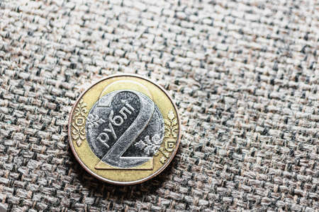 Coin 2 rubles Belarus on a canvas or linen background. Money of Belarusの写真素材