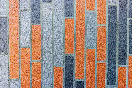 Multi-colored textured plaster of the facade of the house. Monolithic stucco decorative background....