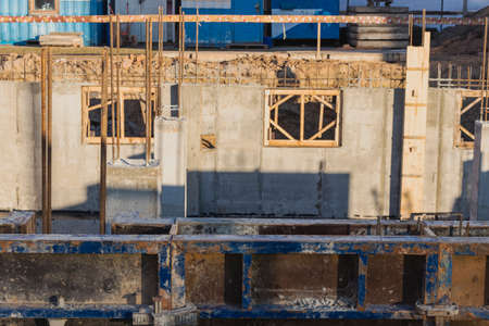 Reinforced concrete foundation of a modern monolithic residential building. Prepared formwork with...