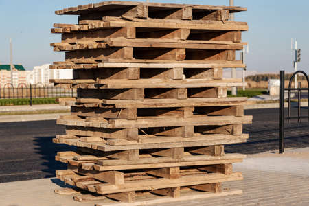 Empty pallets at a construction site. Reuse of wooden pallets in constructionの写真素材