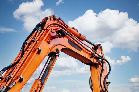 Mini excavator at the construction site. Compact construction equipment for earthworks