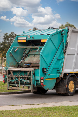 A garbage truck picks up garbage in a residential area. Separate collection and disposal of garbage....