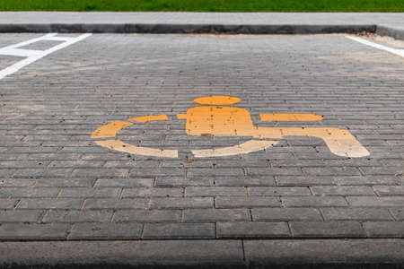 Parking for people with disabilities. A sign indicating a parking place for people with disabilitiesの写真素材