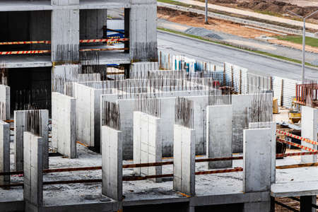 Monolithic frame construction of the building. Solid walls of concrete. The framework for the walls....