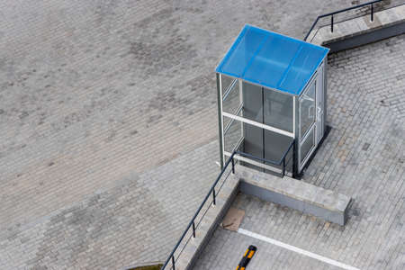 Glass elevator for disabled and disabled people at the entrance to a modern building. Caring for...