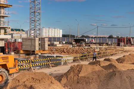 Modern construction site. Start of construction of a monolithic high-rise building. Construction...