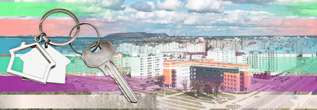 The concept of mortgage and rental housing and real estate. Credit. Keychain in the shape of a house...