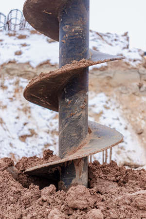 Auger for drilling a well at a construction site. well drilling in winterの写真素材
