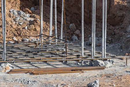 Reinforcement prepared for pouring a reinforced concrete foundation or grillage. Preparation of the base for pouring concrete. Reinforced concrete monolithic work at an industrial construction siteの写真素材