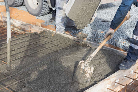 Pouring cement or concrete with a concrete mixer truck, construction site with a reinforced grillage...