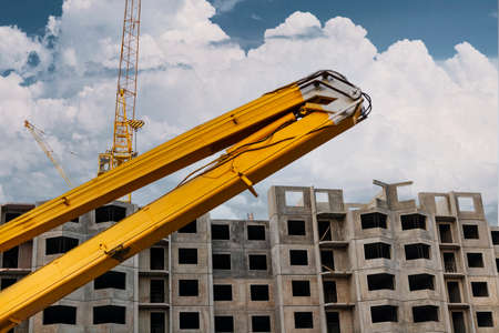 Construction telescopic tower or work platform for people to work at height. Powerful work platform for lifting construction workers upの写真素材