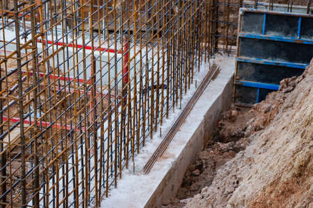 Monolithic foundation with metal reinforcement. Forms vertical formwork structures for the basement...