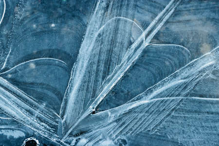 Pieces of ice in nature. Chunks of cracked ice closeup. Broken ice on the lake. Pieces of ice close...
