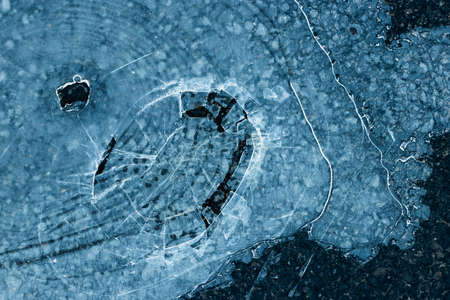 Pieces of ice in nature. Chunks of cracked ice closeup. Broken ice on the lake. Pieces of ice close...