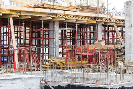 Reinforced concrete foundation of a modern monolithic residential building. Prepared formwork with...