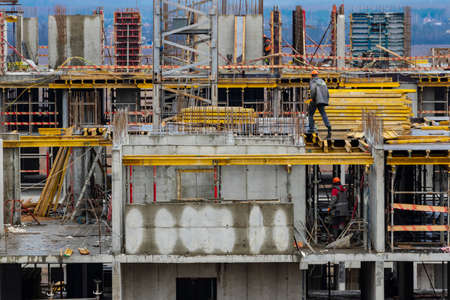 Monolithic frame construction of the building. Workers working at the construction site at home. The framework for the walls. Formwork for walls made of concrete. construction site close upの写真素材