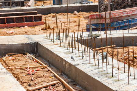 Reinforced concrete foundation of a modern monolithic residential building. Prepared formwork with...