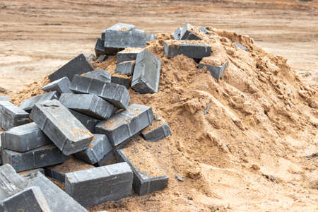 Dismantled paving slabs. Reconstruction of the sidewalk in the city. Construction work on the improvement of the territory. close-up. backgroundの写真素材