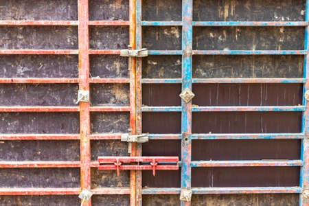 Reinforced concrete foundation of a modern monolithic residential building. Prepared formwork with reinforcing mesh for pouring concrete. Monolithic construction technologiesの写真素材