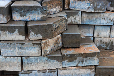 Gray paving slabs at a construction site. Material for paving roads and sidewalks. close-up....