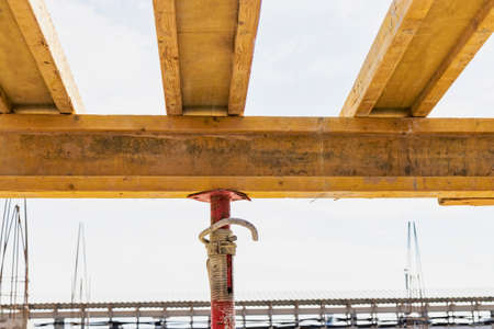 Formwork for pouring the second floor of a monolithic building. Reinforcement of walls and ceiling. Monolithic work during the construction of a building close-up. construction technologiesの写真素材