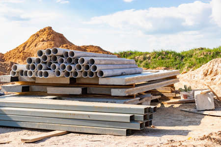 Building materials at a construction site. Prepared materials and embedded parts for foundations at...