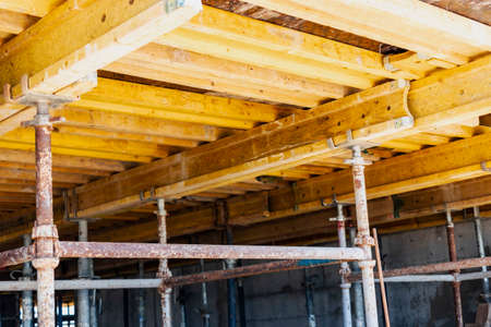 Formwork for pouring the second floor of a monolithic building. Reinforcement of walls and ceiling. Monolithic work during the construction of a building close-up. construction technologiesの写真素材
