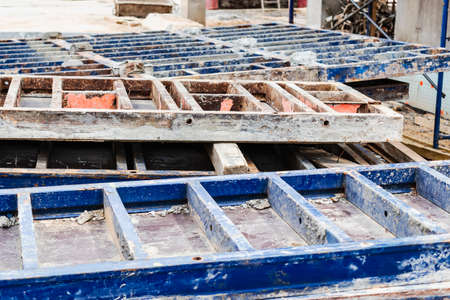 Reinforced concrete foundation of a modern monolithic residential building. Prepared formwork with reinforcing mesh for pouring concrete. Monolithic construction technologiesの写真素材