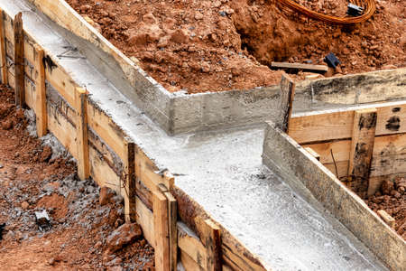 Reinforced concrete foundation of a modern monolithic residential building. Prepared formwork with...