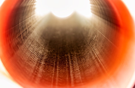 Orange sewer pipes at the construction site. Preparation for the installation of an underground sewer system. Wastewater disposalの写真素材