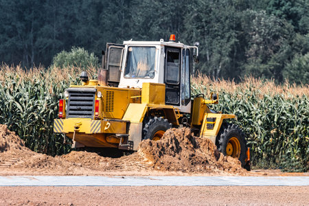 Powerful crawler bulldozer close-up at the construction site. Construction equipment for moving...