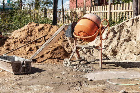 Industrial concrete mixer at a construction site. Mixing concrete and mortar on site. construction equipmentの写真素材