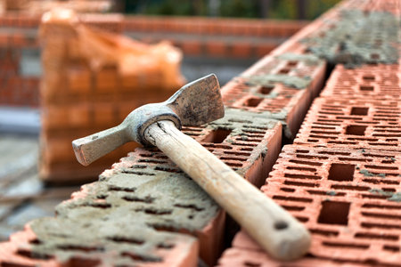 Construction tool for laying bricks and blocks. Bricklayer's tools - hammer, spatula, trowel,...