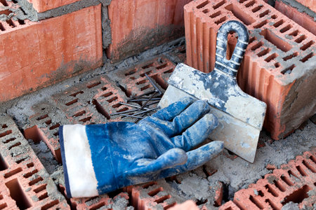 Construction tool for laying bricks and blocks. Bricklayer's tools - hammer, spatula, trowel,...